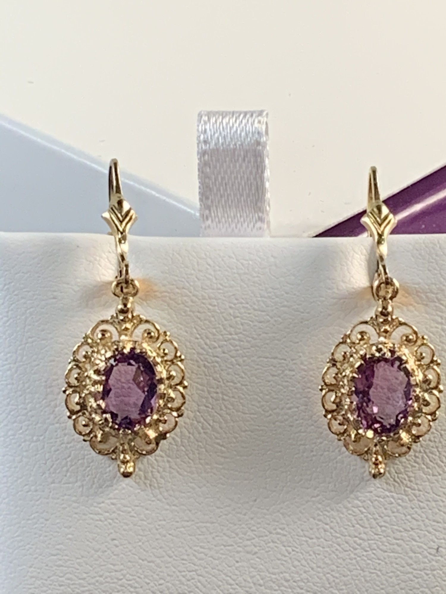 Oval Amethyst with Filigree Border Dangle Earrings
Lever back style. 8 x 6mm. Medium color.
$355