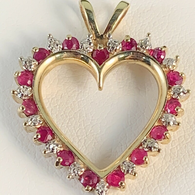 Natural Ruby & Diamond Heart Pendant.
Rubies total approximately 1/2 carat.
Diamonds are accent only but have illusion of 1/2 carat.
Rabbit Ear Bail
Chain Sold Seperately.
10 Karat Yellow Gold
$399