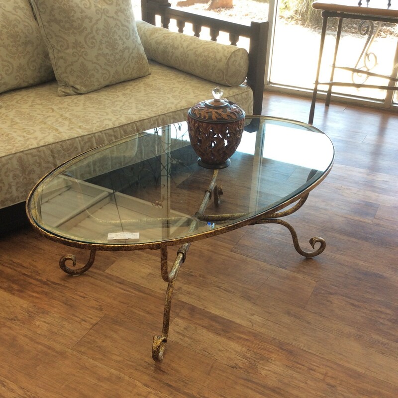Very pretty glass top oval coffee table with a gold mottled finish.
Measures 48x30x17
