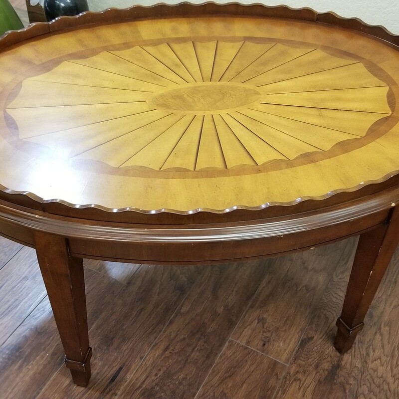 Beautiful oval wood table with pie crust edge and inlaid design.
There are a few nicks, see photos
 Size: 36 long x 26 wide x 21 high
IN STORE PICK UP ONLY