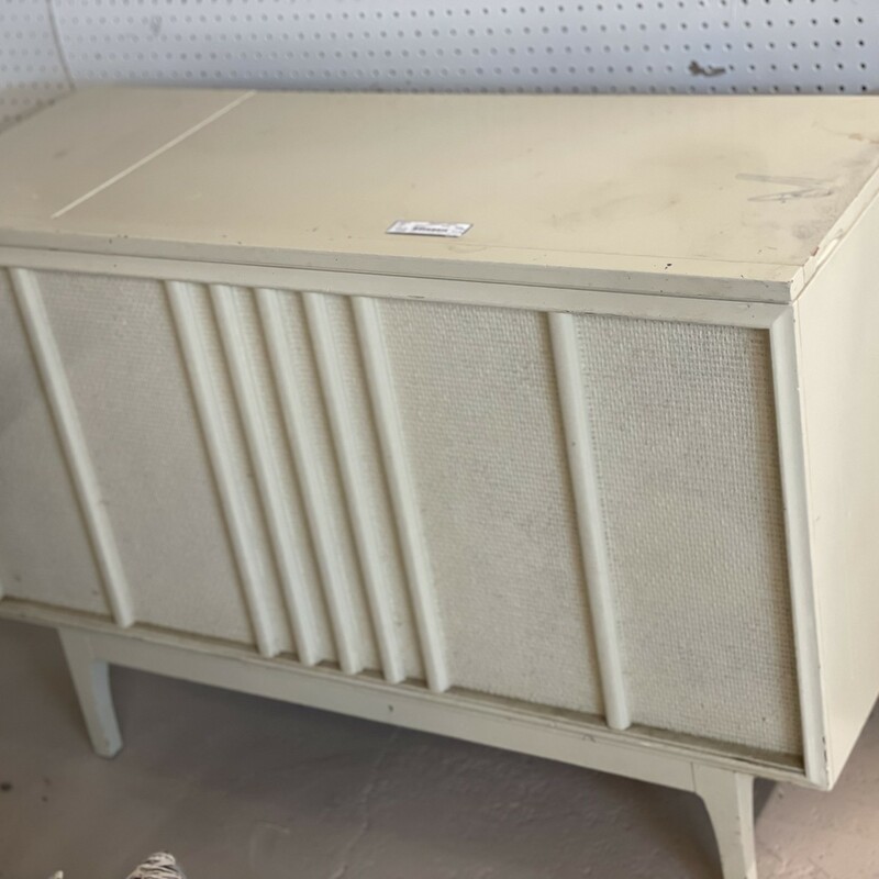 ENDLESS Possibilities!
Vintage Console
This piece has been painted and needs a new coat of something fun! There is a Motorola Golden Voice speaker (or is that a woofer?) in the inside.
White
Size: 44L/ 17D/ 31H