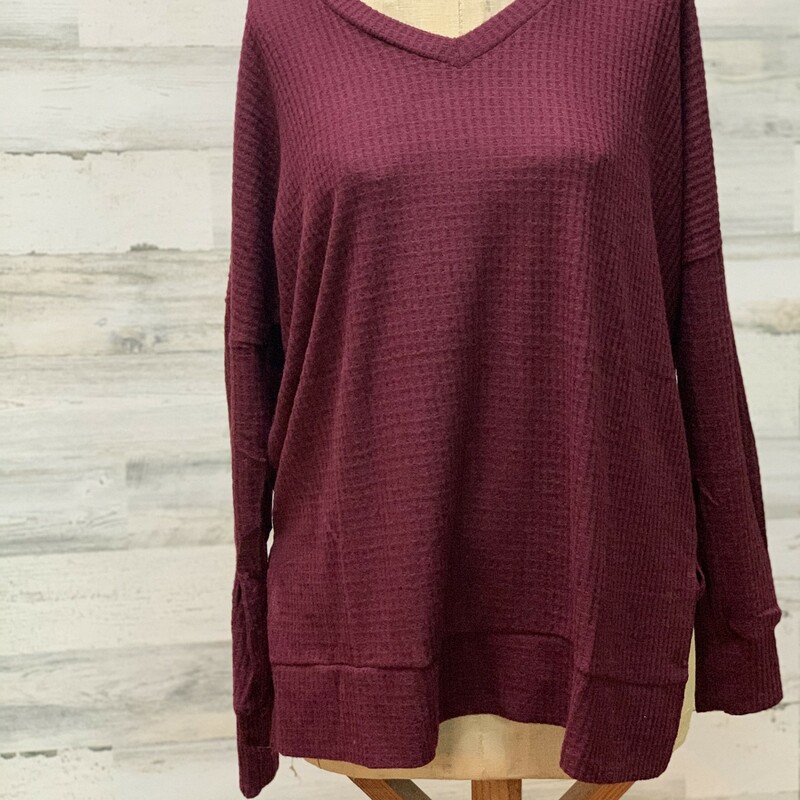 Burgandy Waffle Knit Sweater Size Large. These pair so cute with Jeans or Leggings. Personally, I use these as a pullover during cool weather- over T-shirts when I am keeping it casual, and then I add a ruffle slip or dress underneath it when I want to dress it up.This Item is Long Sleeve. Made of 59% polyester, 38% Rayon, and 3% spandex.