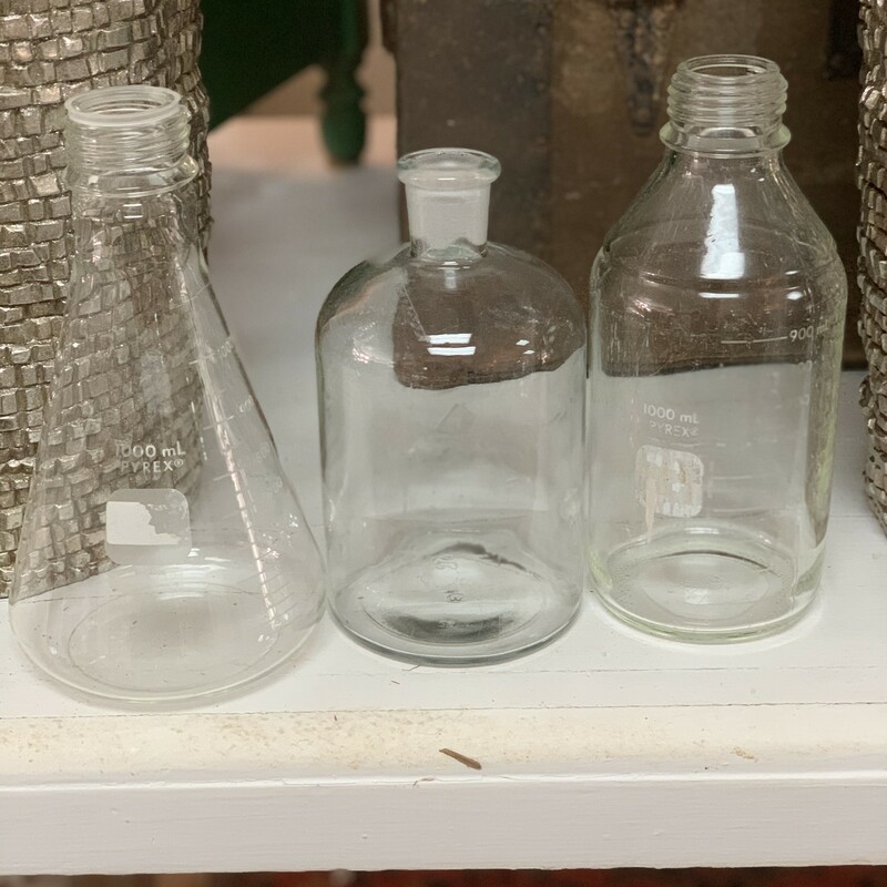 These glass chemistry beakers are out of a textile mill local to Lanett, AL. the styles vary but all hold the same amount. When ordering be sure to note the style you would like.