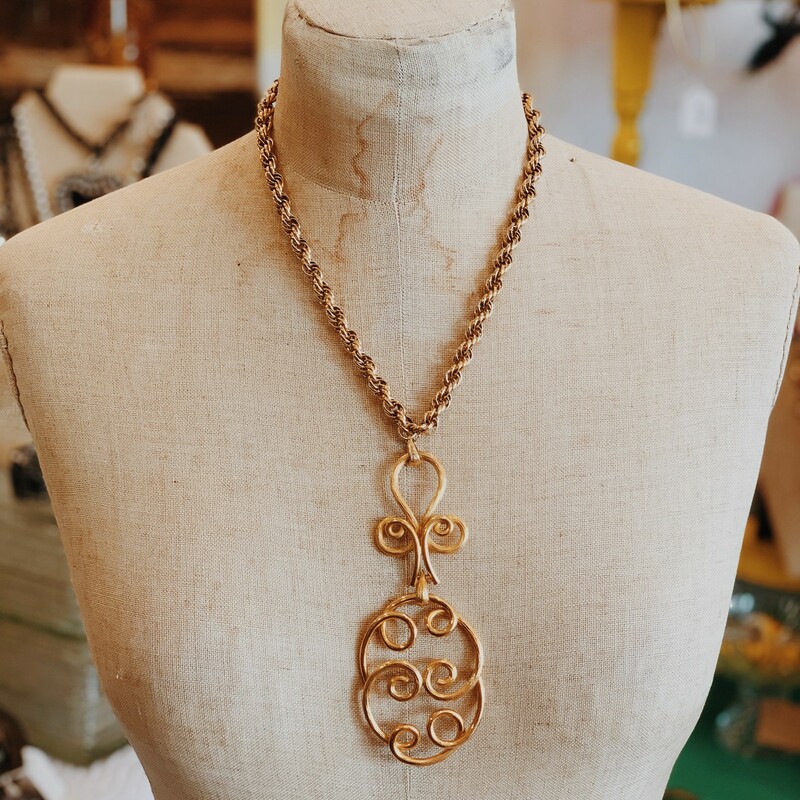 This gold necklace is such a unique piece. Perfect for any eclectic styles out there!