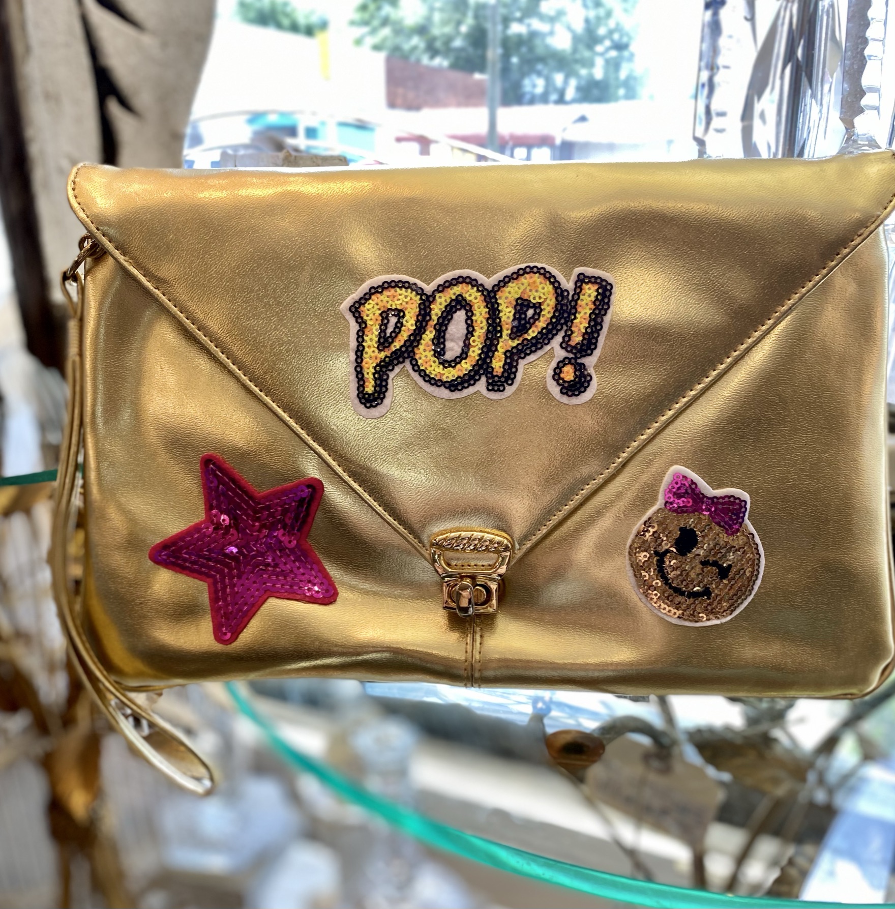 This is the cutest vintage gold up-cycled clutch handbag with on trend colorful designs. It is plenty large enough for a cell phone and date night essentials. It has a wrist strap & shoulder strap