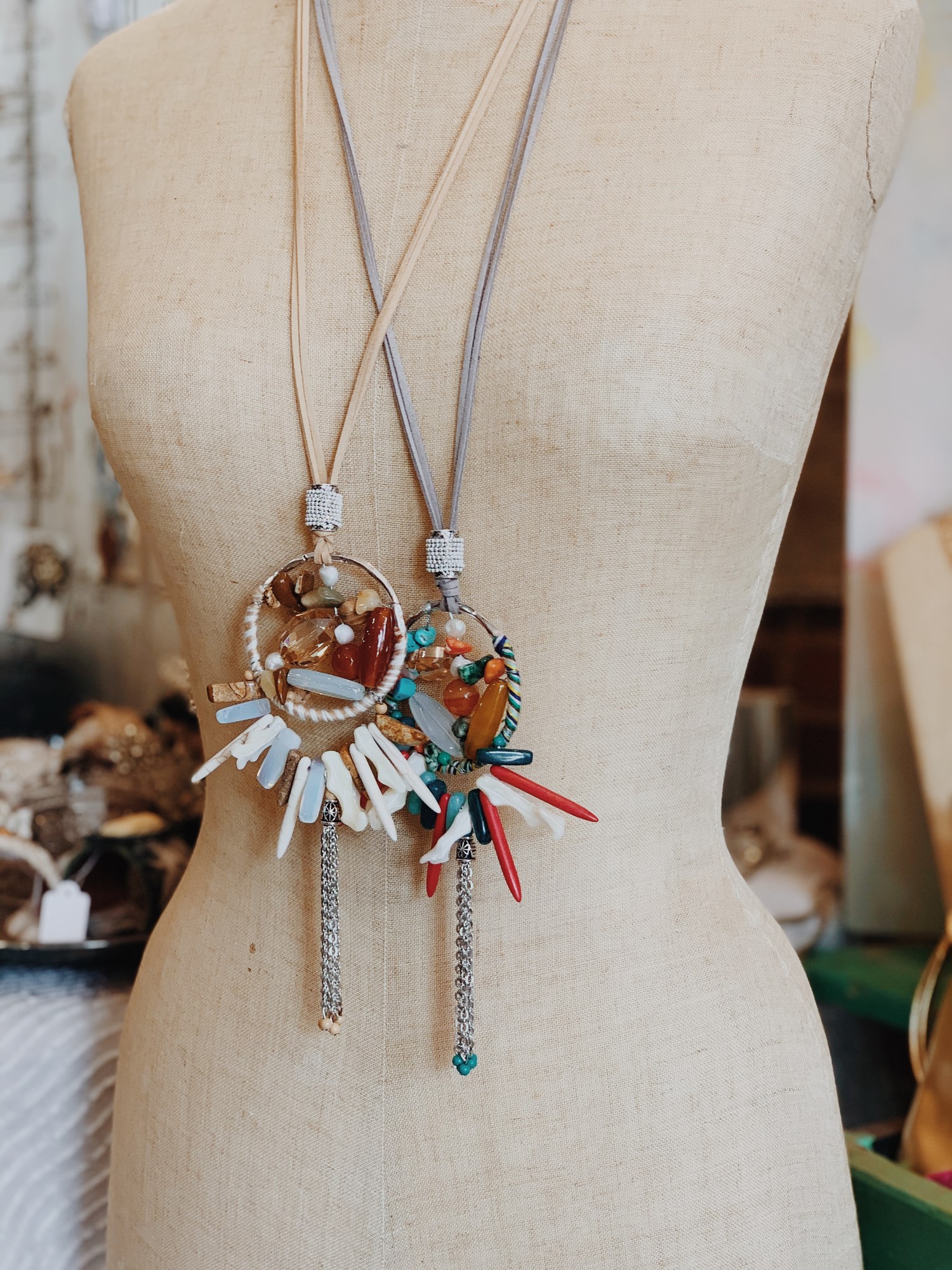 The pendant on this necklace is magnificent! Avalible in nuetral brown tones or red and blue!