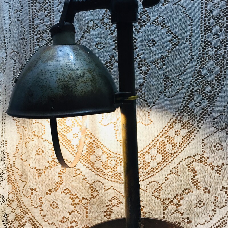Steampunk pump handle lamp with covered shade.
Clearcoated for proctection.
Bulb included.

Ht.  28 inches   W  16 inches