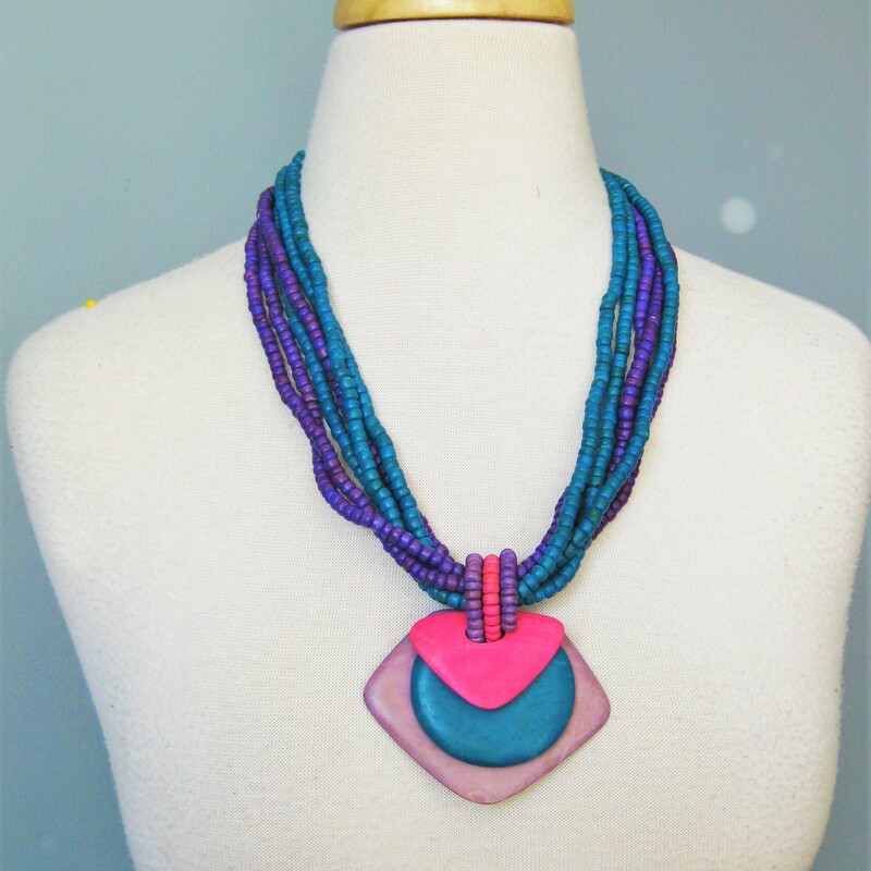 Multistrand Wood Pendant, Purple, Size: None
Quintessental 80s necklace.
You would have worn this to work over a perfectly matching big shouldered silky patterned dress.
It's a multistand pendant necklace with small teal and purple beads and a semi tribal looking pectoral pendant in pink, teal and lavender layers.
All wood.

23in long
closes with a hook
thanks for looking!
#40102
