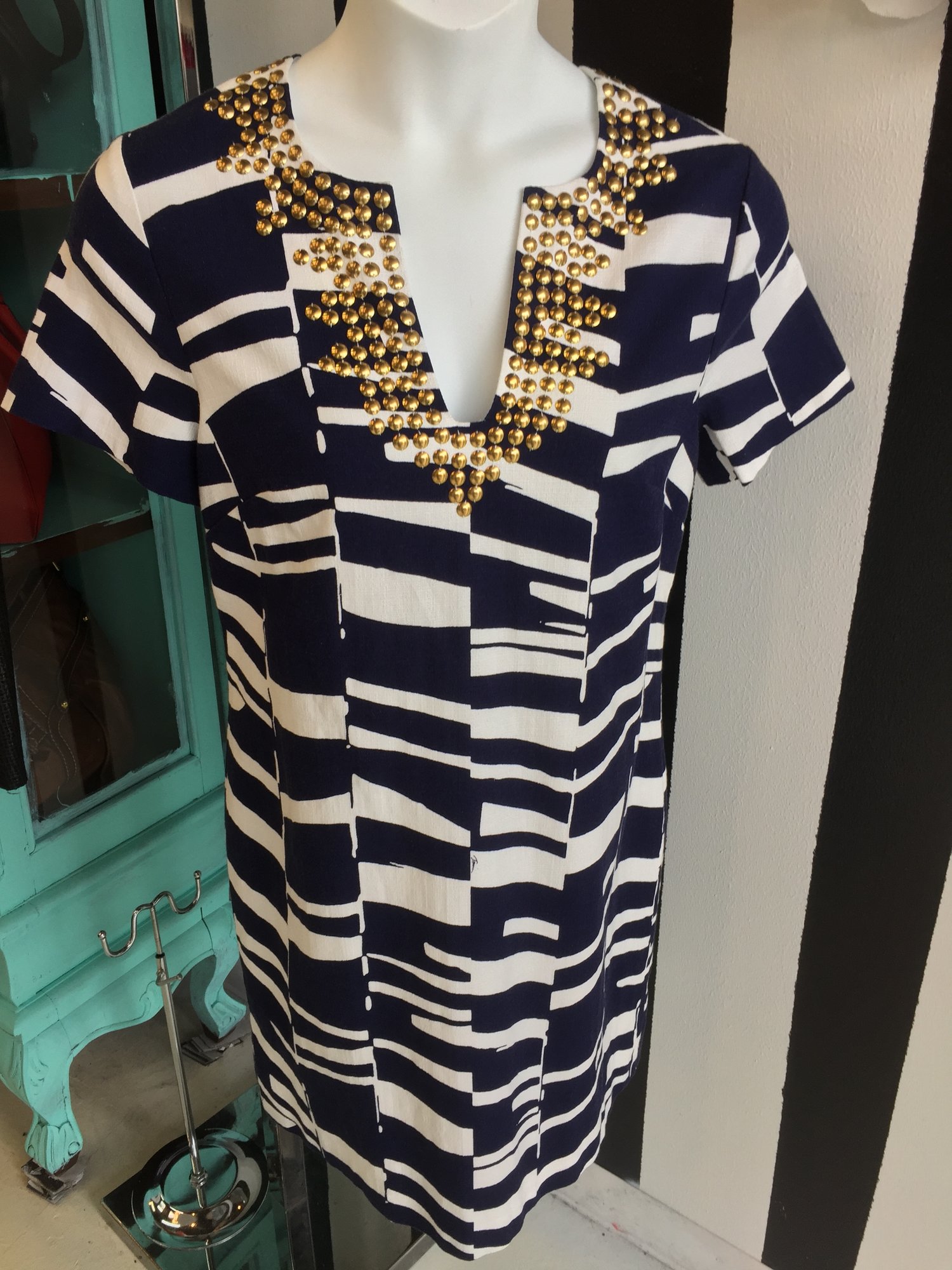 Chic Trina Turk dress. Brand new, size 10. Navy with white stripes and gold detail. With retail tags. Retail price: $398