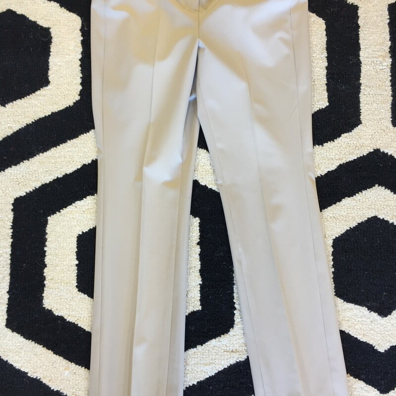 Worth slacks that are lightly worn. They are made of polyester and spandex! Great for all seasons. Size 4; Khaki