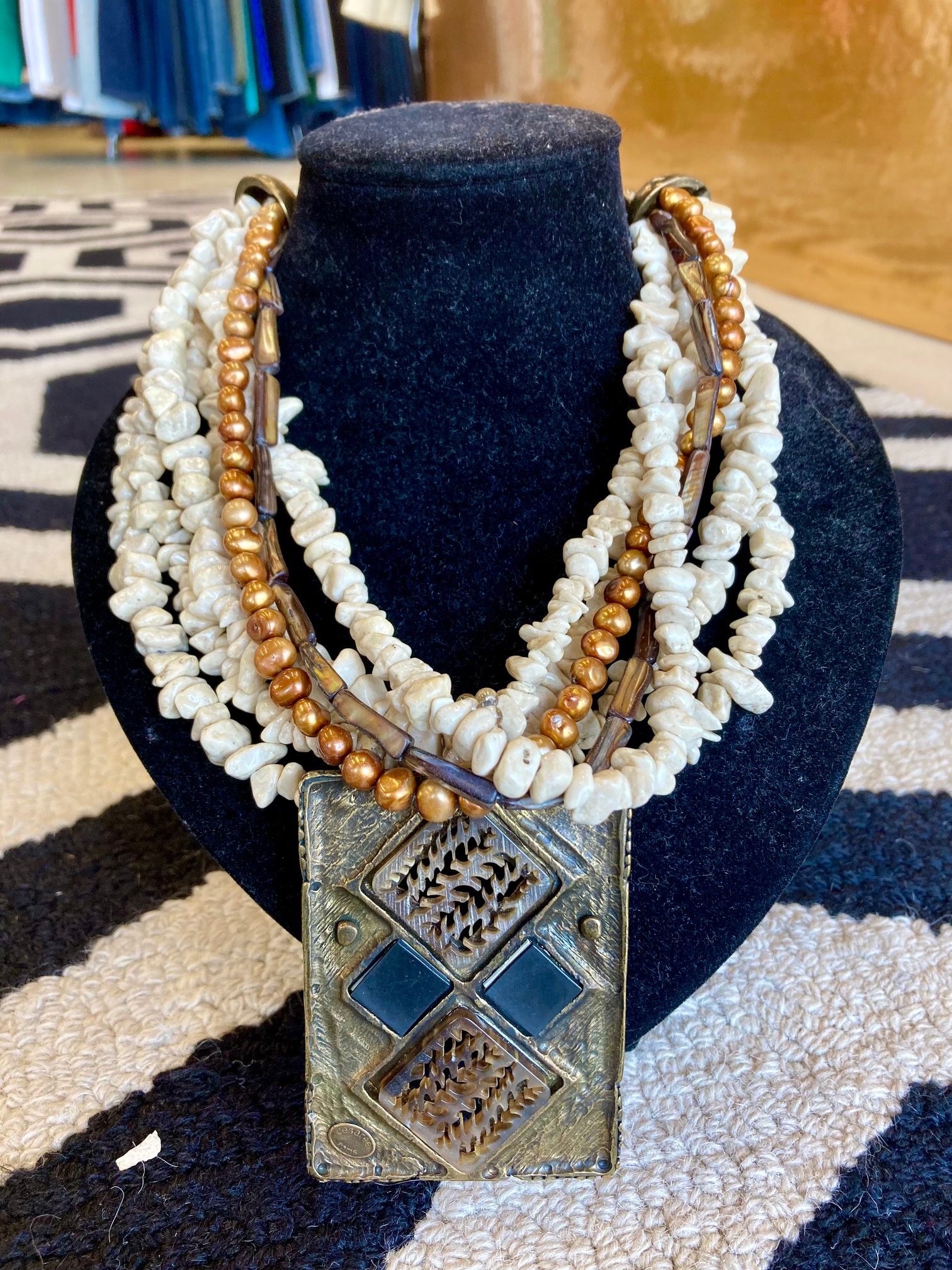 Cesaree Necklace: This one of a kind piece from Paris has beautiful detail and colors.  Natural stones and intricate medallion.  Ivory and citrine colors with bronze.