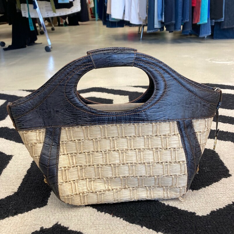 Brahmin- This is a classic summer piece.  This Brahmin is in great shape with only a small mark on the bottom.  Dark brown and straw color.