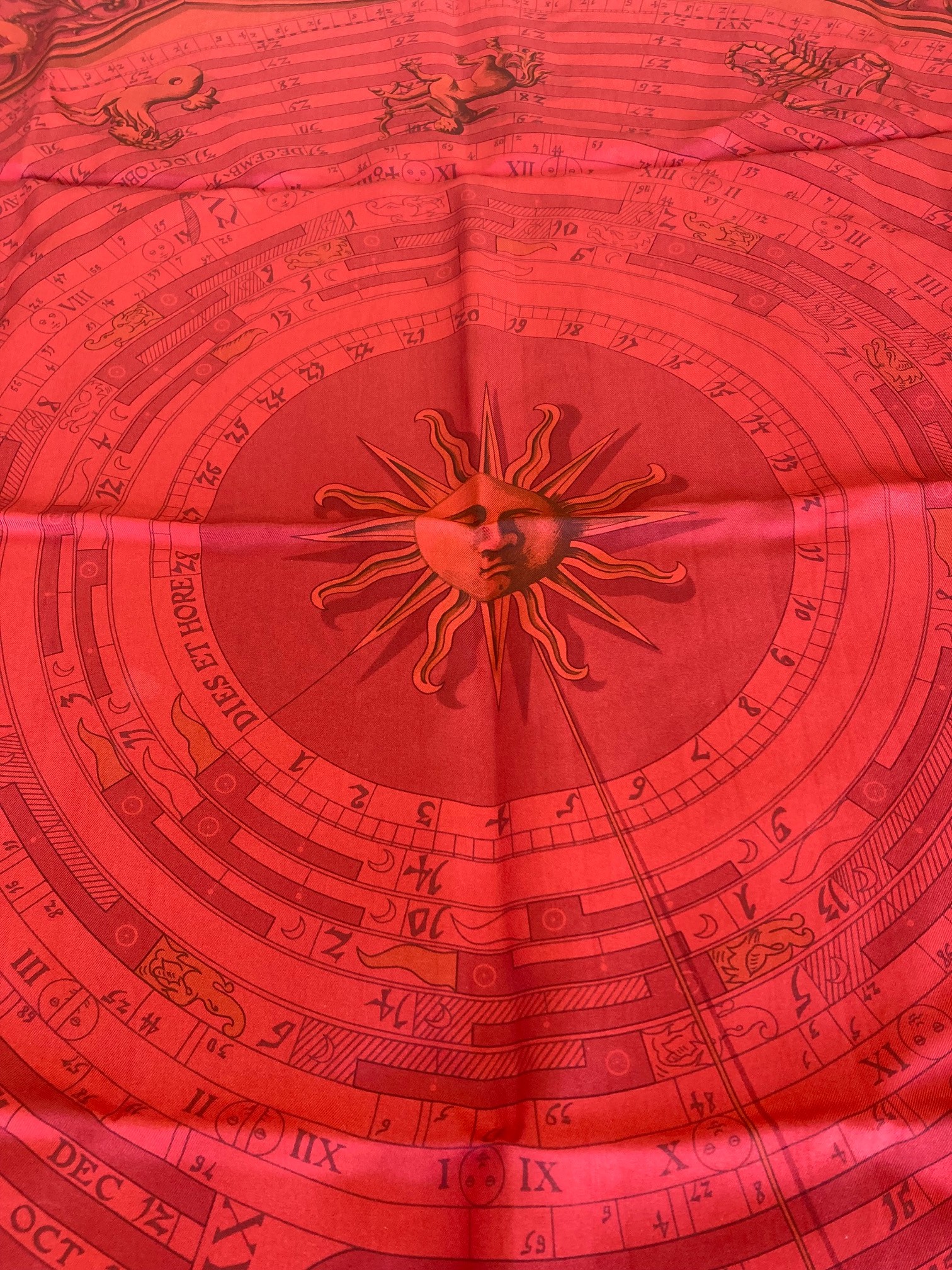 Hermes Scarf: Don't miss this great deal on this authentic Hermes scarf. It's in perfect condition with a  Zodiac pattern. Red.