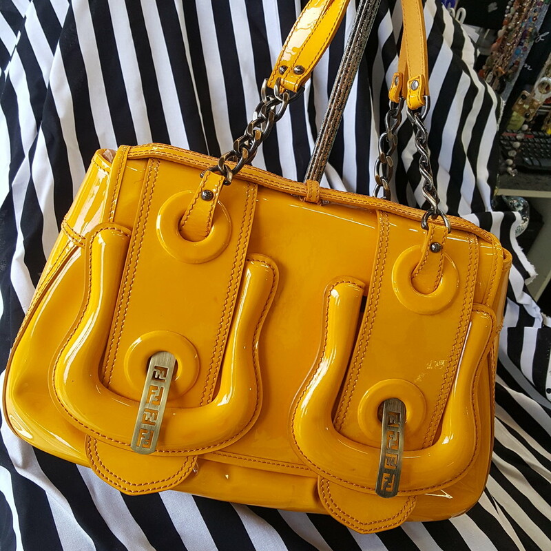 Beautiful Bright yellow Patent leather Fendi tote. With brushed antique gold chain handles. Button clasp front with metal Fendi emblem detail on front. Good condition! Some scratches on back, but very light wear. Otherwise great bag!! Retail: $1,950