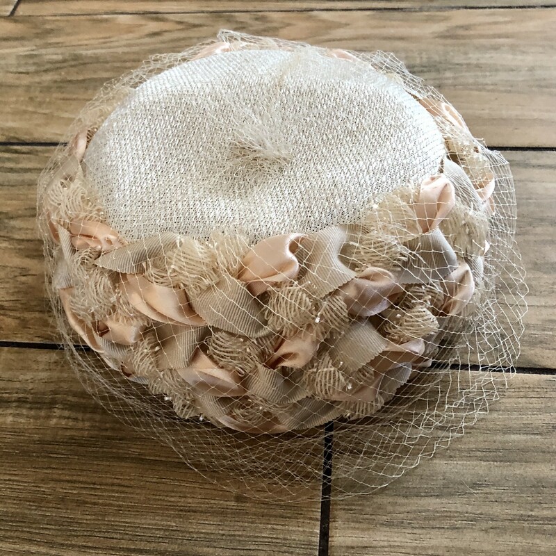Straw Pill Box Hat with ribbon design and veil. Cream color with cream & peach ribbons and a cream Veil, Size: marked size 23 for those of you that know your hat size but for the rest of us, it's approximately 7in front to back and 7in side to side.