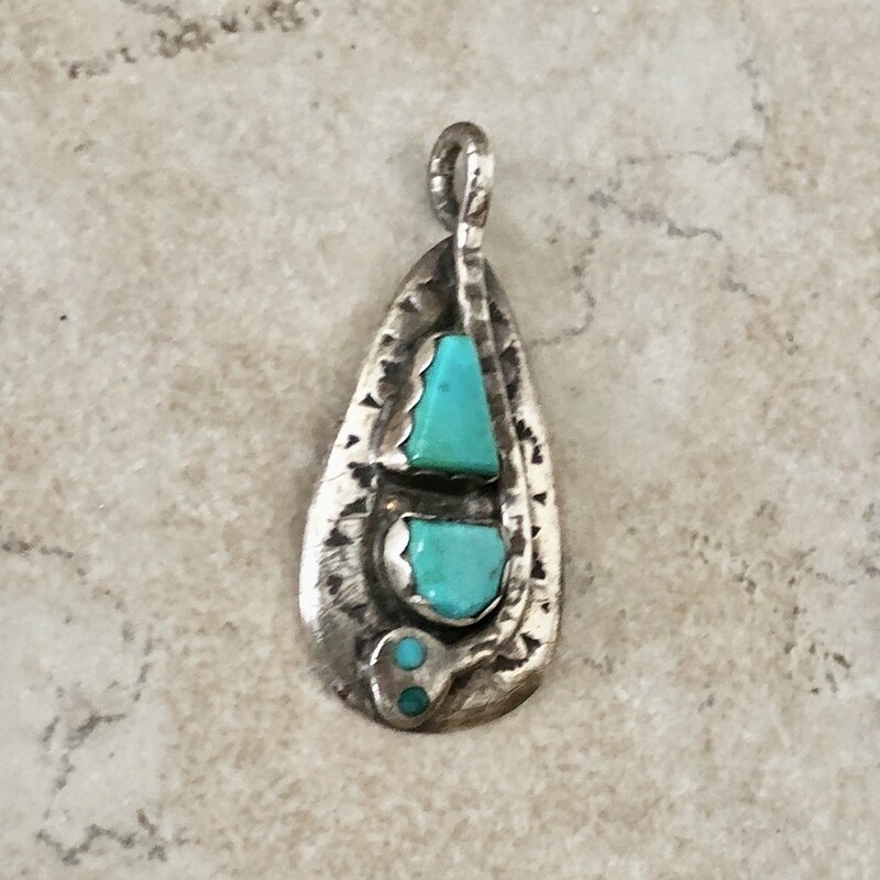 Vintage Zuni sterling & turquoise snake motif pendant handcrafted by master zuni artist Effie Calavaza.
Crafted from sterling silver and sleeping beauty turquoise with a total of 4 turquoise stones, 2 inlayed to create the snake's eyes and 2 bezel set. It also has imprinted designs.

The Zuni believe the snake symbolizes rebirth and renewal. 7/8in wide X 1 3/4in high including the bale.