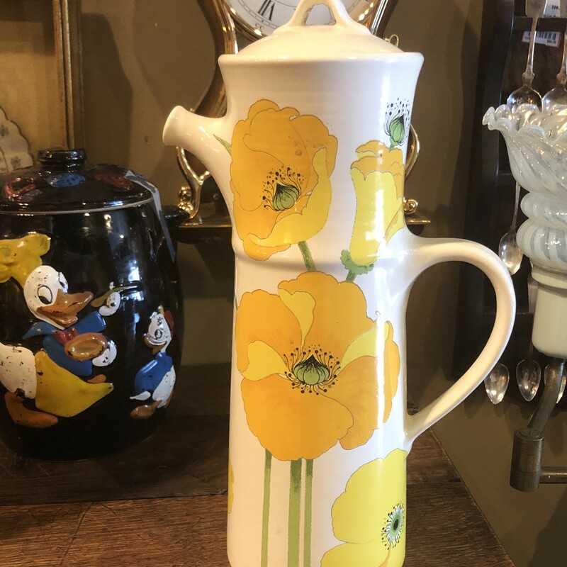 Mid Century Modern Coffee Carafe. Vibrant orange and yellow flowers on a white background. Size: 15in Available for in-store pickup only.
