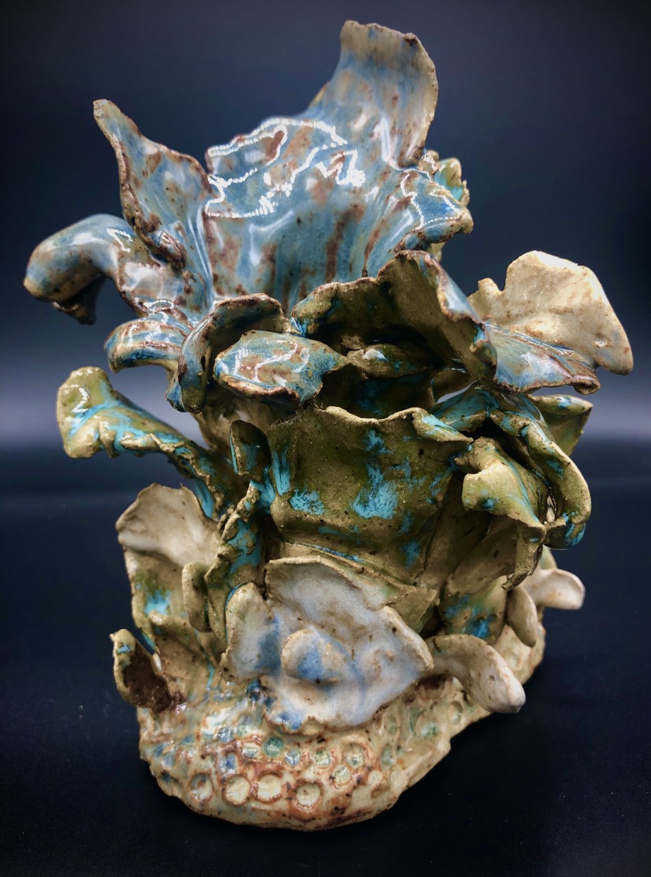 Title: Ocean Lily
Artist: David Gwaltney
Size:7x5x5in
Medium: Clay
Statement: Coral Reef Series,  Brown and White Clay hand built sculpture, Various glazes. Fffired Cone 6