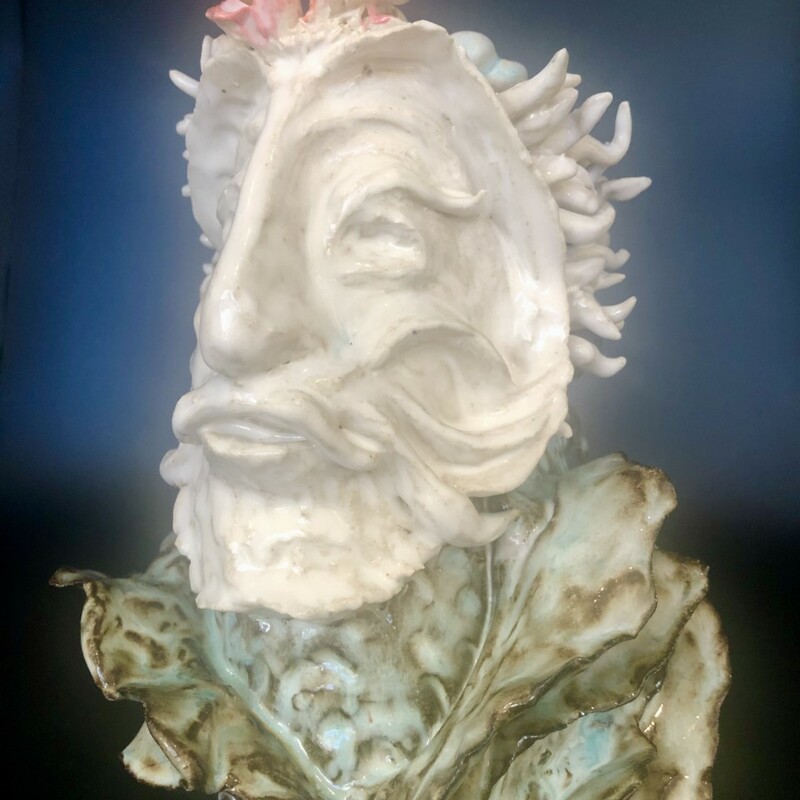 Title: Thereus
Artist: David Gwaltney
Size: 10x7x7
Medium: Clay
Statement: Ocean Reef Series...Hand built vase... Thereus, the mythical King and founder of Athens, He was challenged by KIng Minos of Crete to return his ring that he threw in the sea. He dived in a was lead  by a pod of dolphins to the Sea Goddess, Thetis. She gave him the ring and a jeweled crown. He returned the ring to MInos and kept the Crown for himself.