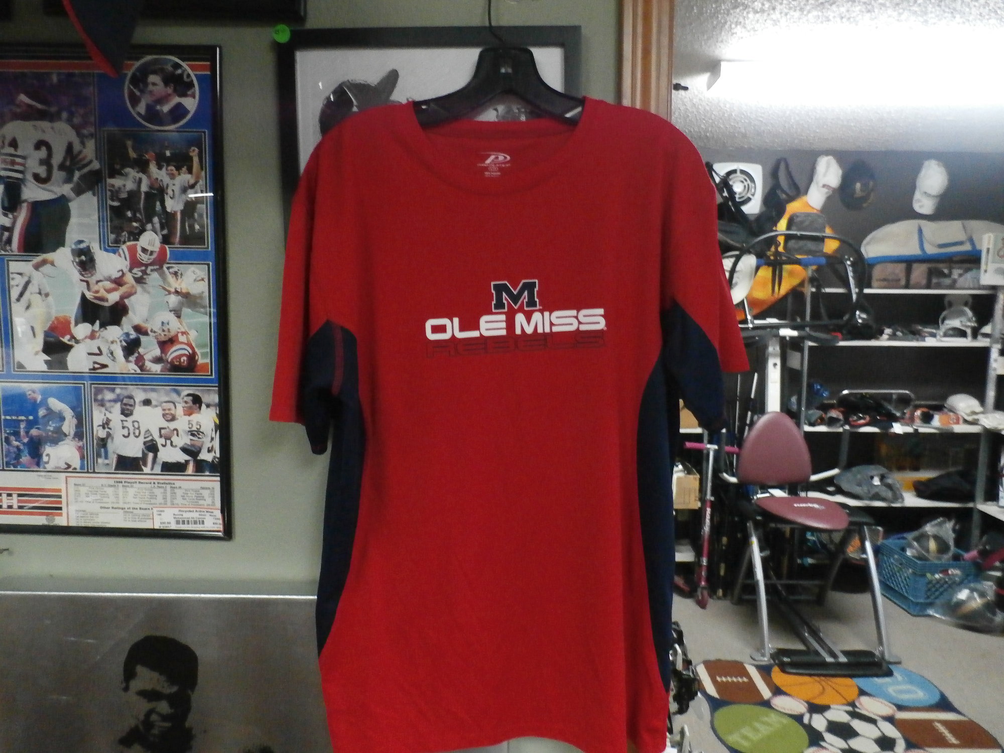 Pro Player Ole MIss Rebels Men's Red size Large 100% polyester  #17012
Rating:   (see below) 3- Good Condition
Team:Ole MIss Rebels
Player: Team
Brand: Pro Player
Size: Large - Men's (Measured Flat: Across chest 22\", length 28\")
Measured flat: armpit to armpit; top of shoulder to the hem
Color: Red
Style: Short sleeve
Material: 100% Polyester
Condition: - 3- Good Condition - Wrinkled;minor snags; minor pilling; fuzz on material;
Item #: 17012
Shipping: $3.37