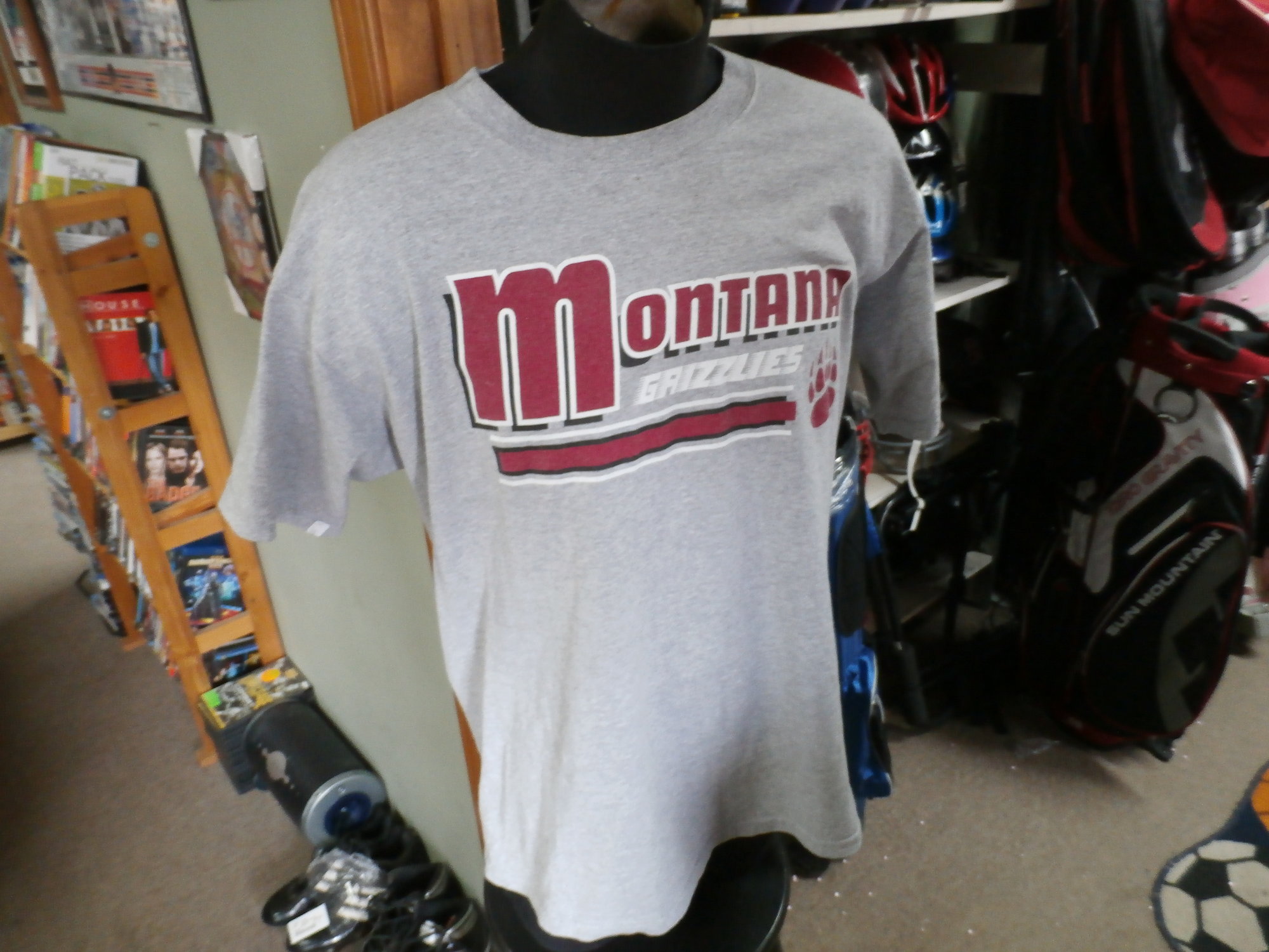 Montana Grizzlies Men's T shirt gray size Large cotton blend #20346
Rating: (see below) 4 - Fair Condition
Team: Montana Grizzlies
Player:  Team
Brand: Greatshirts
Size : Large- Men's (Chest: 21.5\" ; Length: 29\" ) armpit to armpit & shoulder to hem
Color: Gray
Style: T Shirt; screen pressed
Material: 90% Cotton; 10% Polyester
Condition: 4 - Fair Condition - wrinkled; light pilling and fuzz; stretched from wear and wash; neck is stretched out from use; the fabric is faded and discolored; logo has slight cracking and wearing; 2 tiny small brown stains at the front of the neck; has a worn look to it
Item #: 20346
Shipping: FREE