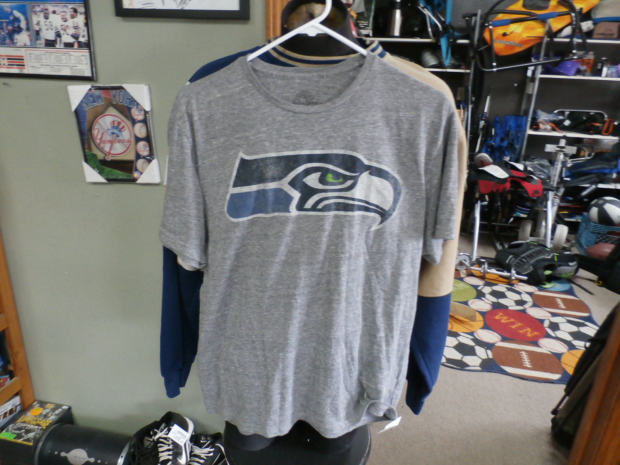 Title: Seattle Seahawks T shirt gray size Large #22284
Our Clothes Rating: 4- Fair Condition
Brand: Retro Sport
size: Men's Large (Chest: 20\" Length: 26\")
color: Gray
Style: basic screen pressed t shirt
Condition: 4- Fair- worn and faded; noticeable pilling and fuzz; front stitched on logo is missing; the front logo is cracked, faded and wearing off; material is faded, discolored and partially see through from washing, use and age;
Shipping: FREE
Item #: 22284