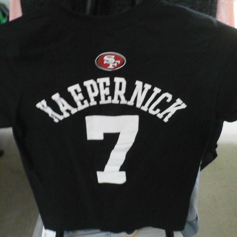 San Francisco 49ers Kaepernick YOUTH shirt black 100% cotton size M 10/12 #22920
Rating: (see below) 3- Good Condition
Team: San Francisco 49ers
Player: Colin Kaepernick
Brand: NFL Apparel
Size: YOUTH Medium 10/12 (Chest: 17\" x Length: 22.5\";) measured flat - armpit to armpit and shoulder to hem
Color: black
Style:  short sleeve; screen printed
Material: 100% cotton
Condition: 3-Good Condition;  wrinkled; some pilling and fuzz; material is worn from wearing and washing; some fading and discoloration; no rips or tears; no stains; screen printing is cracked and worn (see photos)
Item #: 22920
Shipping: FREE