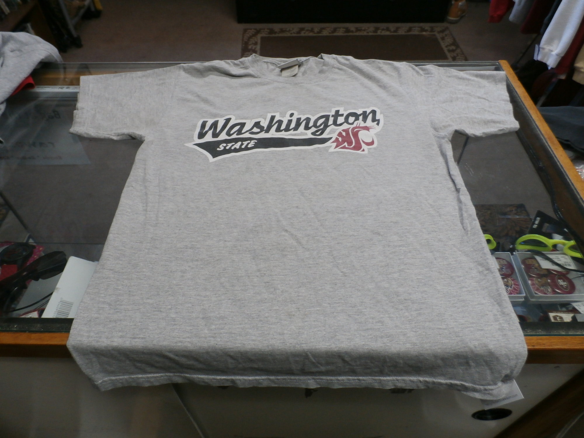 Washington State Cougars Jerzees Adult Short Sleeve Shirt Medium Gray #25307
Rating: (see below) 2 - Great Condition
Team: Washington State Cougars
Player: N/A
Brand: Jerzees
Size: Adult- Medium(Measured: Across chest 20\", length 27\")
Measured: Armpit to armpit; shoulder to hem
Color: Gray
Style: short sleeve; screen pressed logo
Material: 90% Cotton 10% Polyester
Condition: 3 - Good Condition - wrinkled; pilling and fuzz; feels coarse; logo is cracked and worn; definite signs of use; no stains rips or holes
Item #:  25307
Shipping: FREE