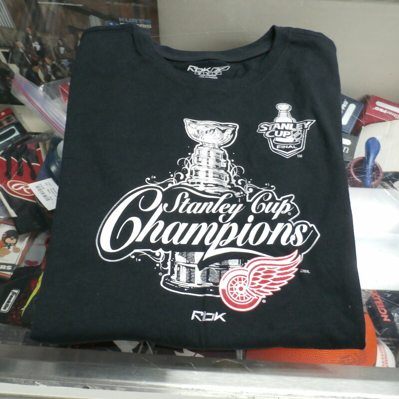 Detroit Red Wings Women's T shirt black size medium Stanley Cup Champions #27433
Rating: (see below) 3- Good Condition
Team: Detroit Red Wings
Player: Team
Brand: Reebok
Size: Women's Medium (Measured Flat: chest 18\"; Length 24\")
Measured flat: armpit to armpit; top of shoulder to bottom hem
Color: Black
Style: screen pressed; t shirt
Material: 100% Cotton
Condition: 3- Good Condition:  Wrinkled; feels soft; pilling and fuzz
Item #: 27433
Shipping: FREE