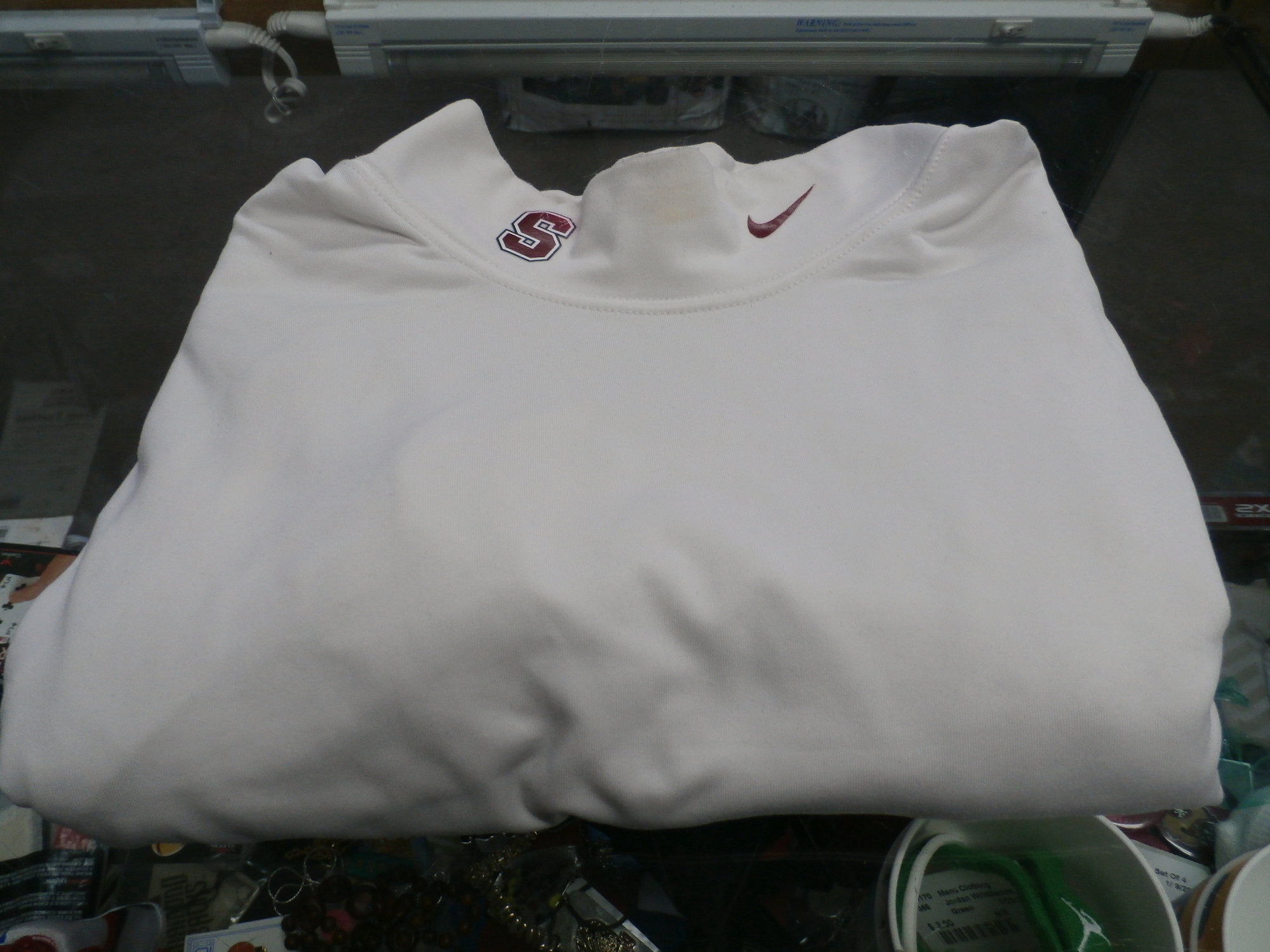 Stanford LS Shirt, White, Size: XL
Nike Men's Stanford Cardinal long sleeve shirt white size XL 28711
Rating: (see below) 4- Fair Condition
Team: Stanford Cardinal
Player: N/A
Brand: Nike
Size:  Men's XL  (Measured Flat: Across chest 19\"; Length 28\")
Measured Laying Flat: armpit to armpit; top of shoulder to bottom hem
Color: White
Style: Long sleeve shirt; Screen pressed
Material: 100% Polyester
Condition: 4- Fair Condition: wrinkled; pilling and fuzz; discoloration from use; some light staining on front and sleeves; staining on collar;
Item #: 28711
Shipping: FREE