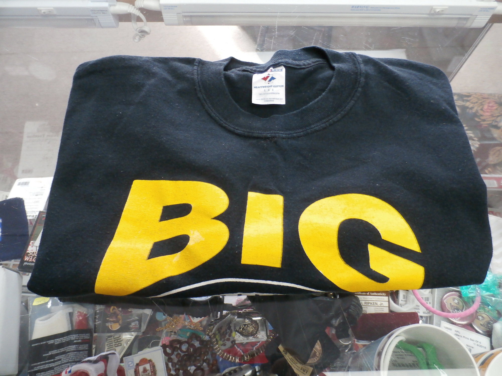 Jerzees Men's \"Big Ben\" (Steelers) Short sleeve shirt black size Large  #30107
Rating:   (see below) 3- Good Condition
Team: Pittsburgh Steelers
Player: Big Ben
Brand: Jerzees
Size: Men's - Large (Measured Flat: Across chest 20\", length 28\")
Measured flat: armpit to armpit; top of shoulder to the hem
Color: Black
Style: Short Sleeve Shirt Screen pressed;
Material: 100% Cotton
Condition: 3- Good Condition - wrinkled;  pilling and fuzz; there is a slight color blotch in the B of big;
Item #: 30107
Shipping: FREE