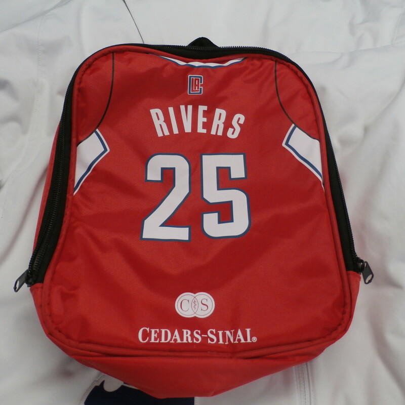 LA Clippers Rivers lunch box red #30718
Our Clothes Rating: 3- Good Condition
Brand: Unbranded
size: One Size - (11\" x 9\")
color: Red
Style: screen pressed; zipper; handle on top; Cedars-Sinai logo on the front
Condition: 3- Good Condition-wrinkled and squished down;
Shipping: FREE
Item #: 30718