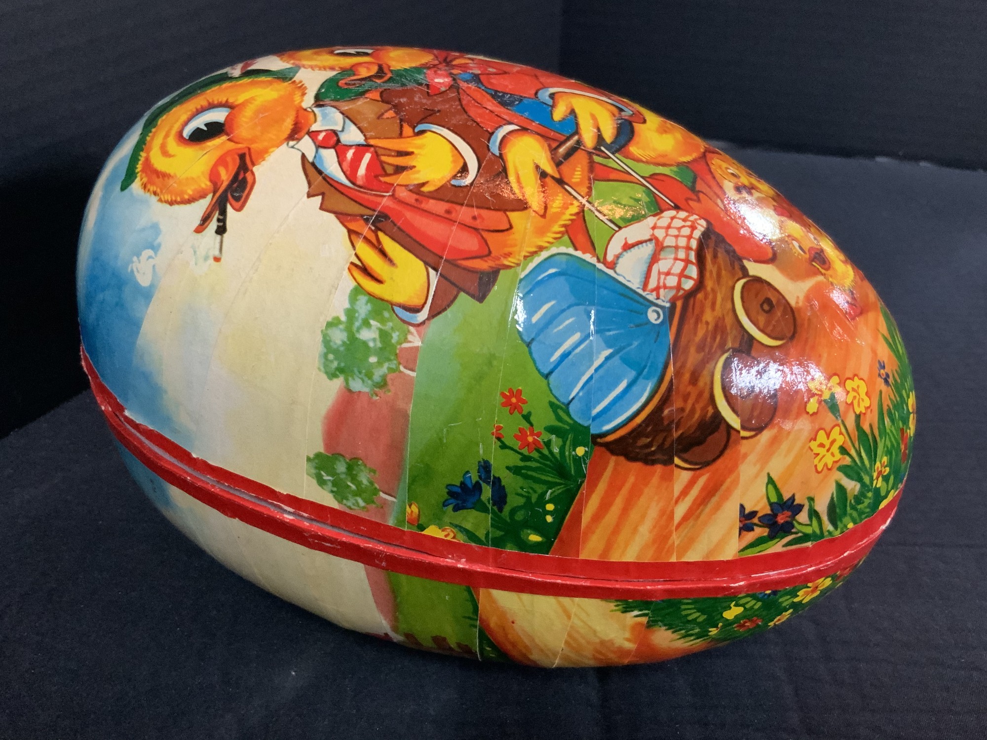German made Egg with Duck family. 10inlong. 6inw x 6 1/2inh.