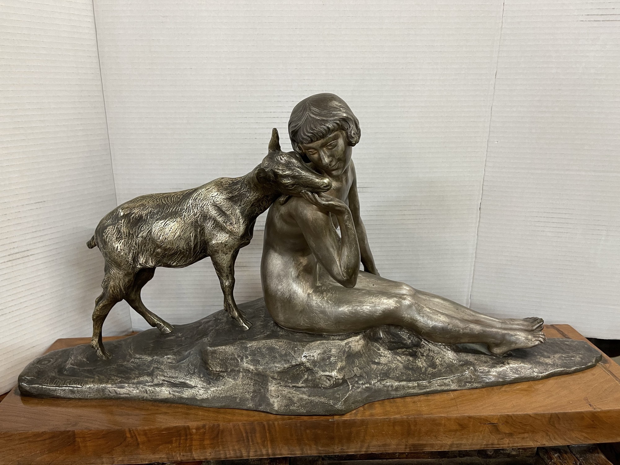 Bronze and wood Nymph with Deer. Situated on a wood base; the Nymph gently caresses the small Deer in hand. Stamped by artist Pierre-Alexandre Morlon (1879-1951) this 32w x 8d x 16h bronze  is offered in great condition!