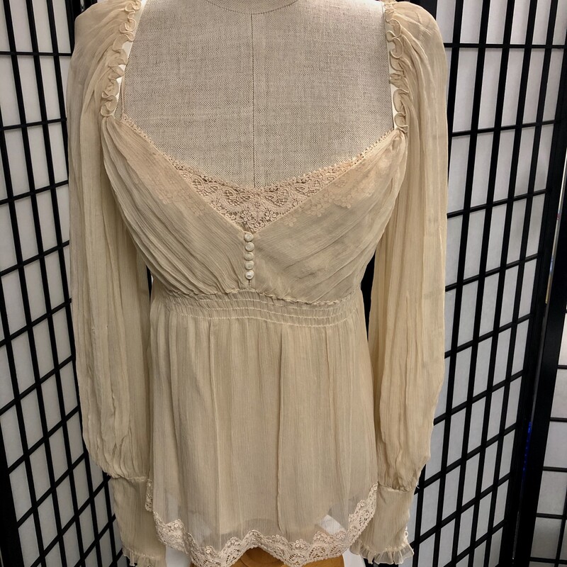 ELLIE TAHARI 2 Pc.Top Set, Beige, Size: S/P.  Blouse = 100% silk, Camisole = 94% silk, 6% elastic.  Blouse is truly so feminine, v necked, doaned with 5 tiny button accent as well as cuffs which also have a total of 11 buttons on each and are ruffled, length = appox. 24\", sleeve length = approx. 32\".  An  accent of lace trim can be seen at base of blouse with matching lace on top of inside camisole.  Blouse also has a gentle elastic strip below bustline which totally extends from front to back.  Again so unique and sheer effect is so delicate.