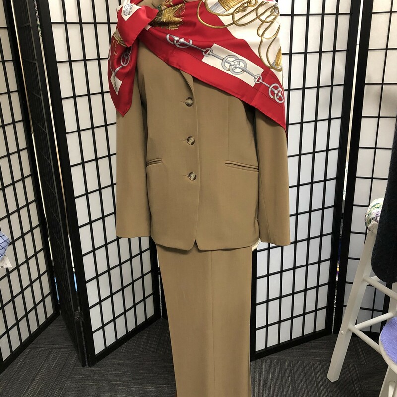 .THALIAN Classic  Brown Slax Suit.  Size 6.  Jacket has a 3 button closure, approx. 26\" length, 2 side pockets. singel button cuff accent.  Slax have 5 belt loops,waist measures approx. 28\" and has 1 small  horizontal pocket located below waist on right hand side.  Tiny spot barely seen on at top of jacket on right hand side.  53 % poly, 43% wool, 4 % lycra. Could be accessorized with lovely scarf as pictured or you may choose a tailored blouse or simply a lovely broach.  Again a simple classic .