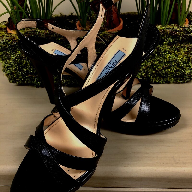 PRADA SLINGBACK MULTI  STRAPPED  LEATHER STILETO HEELS - SIZE 38.  The stiletto heels measure 4.5\" high with platform.  Again multi strapped styling with a tortoiseshell closure at ankles.  Prada characteristically runs 1/2 smaller.  Condition is very good - minor scraping on soles. Lovely accessory for that \"little black dress\"!