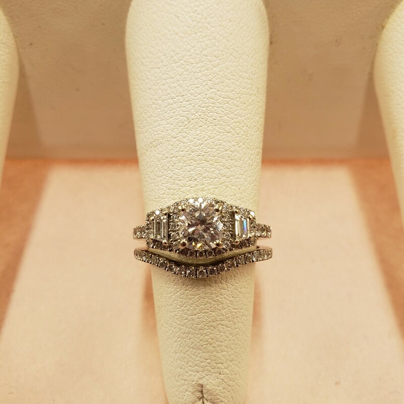 Gorgeous halo vintage style wedding set
1.01F/SI2 center cushion cut diamond GIA certified.
.55cts of trapezoid and round cut side stones with G color and SI clarity.
Matching band: .29cts G/SI pave set round diamonds.
Size 6.5

Can be sized up or down for an additional fee
Pictures do not do the jewelry justice.
Photo ID required for pick up of online purchases. We will not ship jewelry purchases.

All jewelry has been checked by a Certified Gemological Institute of America (GIA) Accredited Jewelry Professional (AJP) and/or appraised by a certified local jeweler.