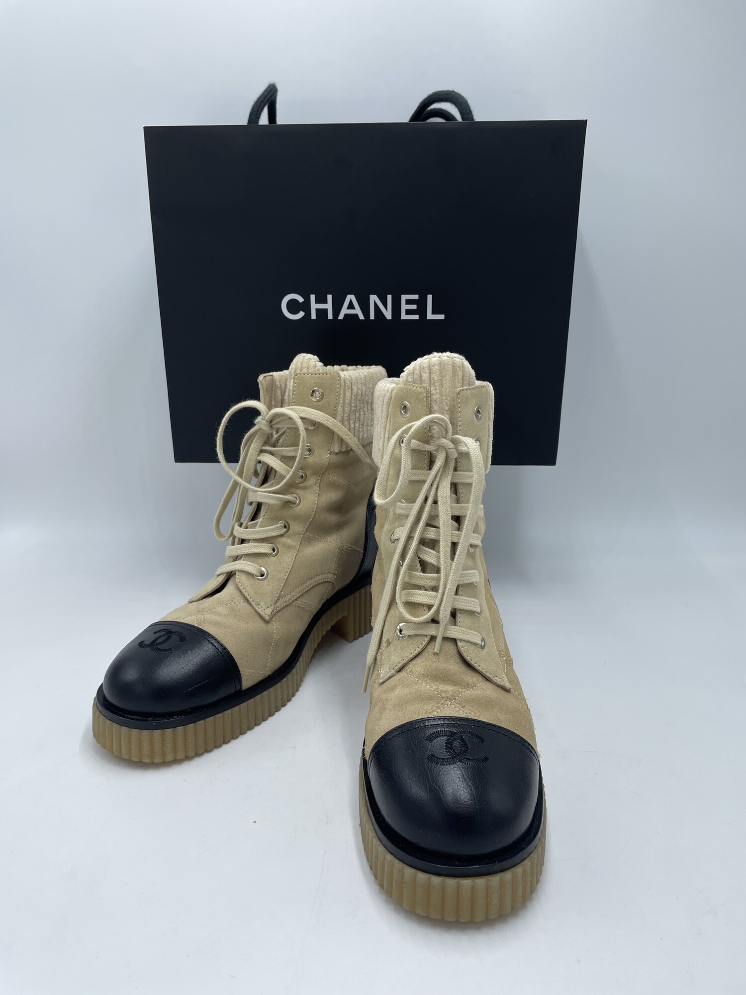 Chanel Quilted Combat Boots<br />
Color:  Tan, Black<br />
Size: 39<br />
Conditon: small spot near bottom lace