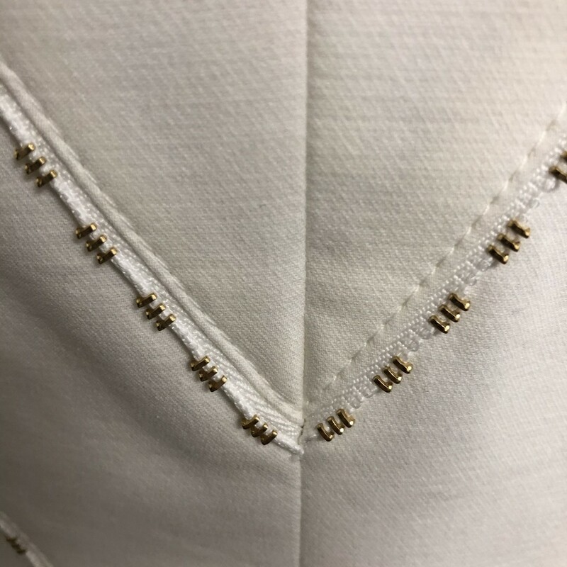 ESCADA WHITE-GOLD STITCHED SLACK SUIT - SIZE 34/36.  SMART!!  Jacket  has a 2 button closure,V neck with a pointed collar.  Distinctive stitching throughout the front  as well  as the back.  Jacket  has tag of size 34 (US S) and approximate measurements are :  bust = 34\", waist = 30\", shoulder = 15.5\", length = 23.5\", sleeve = 24\". Slim fit and fully lined.  Slacks have  a tag of size 36 yet HAVE BEEN ALTERED which picture  shows and believed to complete the size 34 of jacket.  Straight legged, have frontal stitching across  waist with single button zippered closure. Approximate measurements:  waist = 27.5\", hip = 25\",rise = 9\", leg opening = 13\", inseam = 26\".  Condition = very good -minor wear throughout.  Composition = 98% wool, 2% elastic.  Would look so very fashionable with simply a gold heel and bag.  Timeless!!