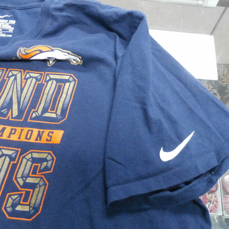 Denver Broncos 50th Super Bowl Champs Nike Adult Short Size 2XL Blue #25895<br />
Rating: (see below) 3 - Good Condition<br />
Team: Denver Broncos<br />
Events: 50th Super Bowl<br />
Brand: Denver Broncos<br />
Size: 2XL - Men's(Measured Flat: Across chest 24\", length 29\")<br />
Measured flat: armpit to armpit; top of shoulder to the hem<br />
Color: Blue<br />
Style: Short sleeve shirt; screen pressed shirt<br />
Material: 100% Cotton<br />
Condition: 3 - Good Condition - wrinkled; faded and discolored; pilling and fuzz; feels coarse; logo looks great; bottom is curled; normal signs of wear; no stains rips or holes<br />
Item #: 25895<br />
Shipping: FREE