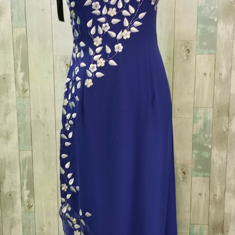 Fiesta long formal with embroidered and beaded flower and ivy pattern. Lightly padded cups, asymetrical hemline over sheer, embroidered mesh<br />
Side zip closure<br />
Royal and silver<br />
Size: Medium<br />
REMEMBER: There are no returns so we suggest you stop in and try it on