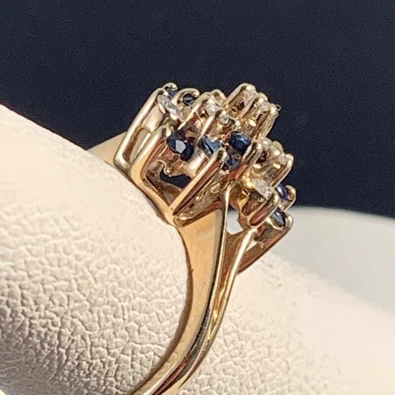 9 Blue Sapphire & 7 Diamond Cocktail Ring<br />
Diamond total approximately .40 caratst and<br />
Sapphires total approximately .70 carats.<br />
Size 4.75. Can be sized up to 6.5<br />
<br />
$590