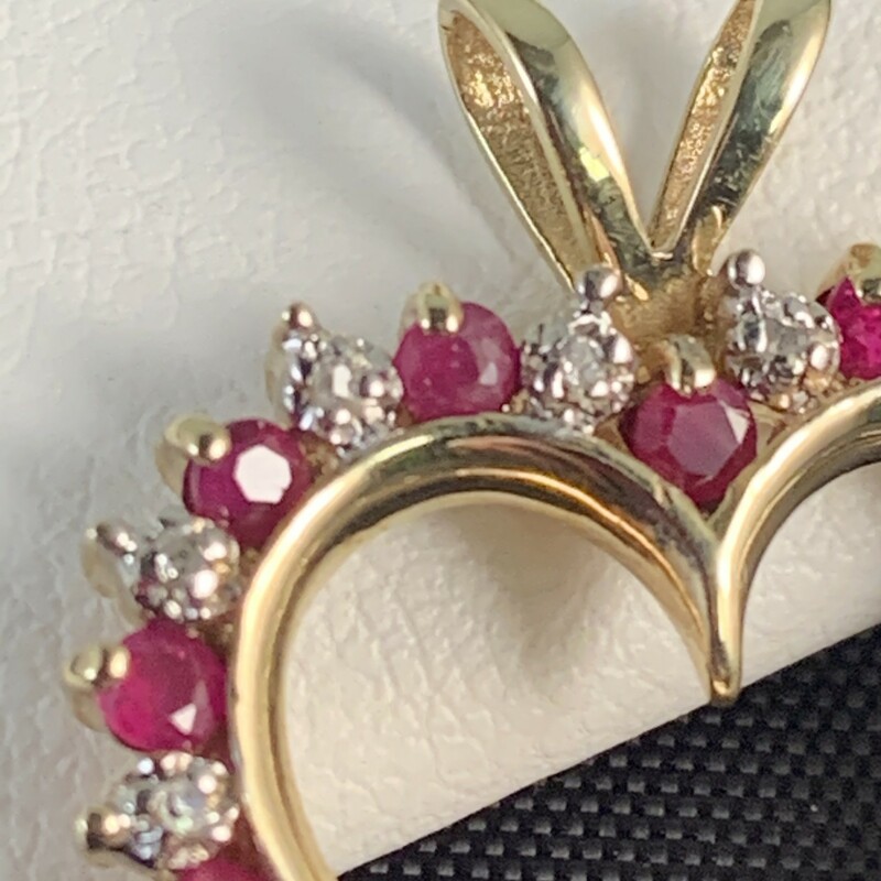 Natural Ruby & Diamond Heart Pendant.
Rubies total approximately 1/2 carat.
Diamonds are accent only but have illusion of 1/2 carat.
Rabbit Ear Bail
Chain Sold Seperately.
10 Karat Yellow Gold
$399