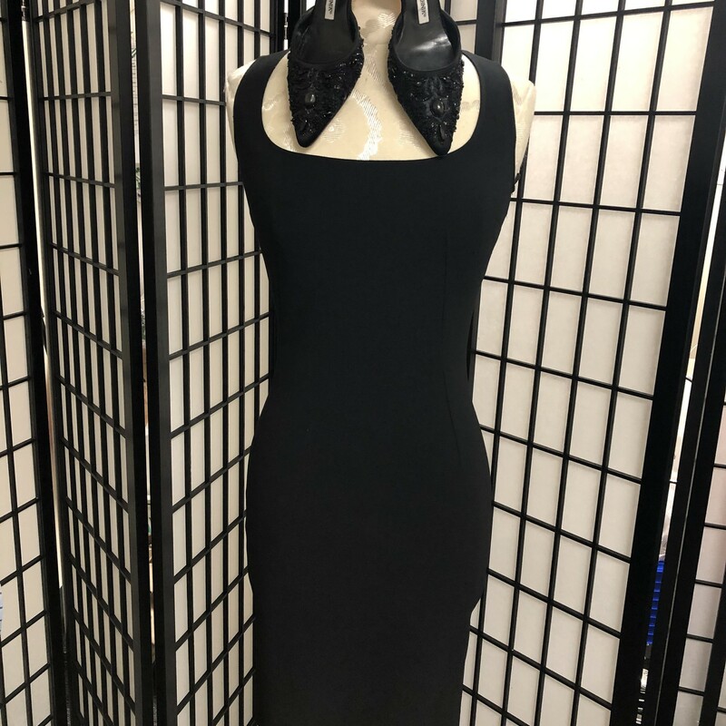 DOLCE & GABBANA BLACK SHEATH DRESS- SIZE 40 (iTALY)  -  US 4.  What can we say?!!  Looking for that \"little black dress\" which would be a tineless staple in your closet this one is most definately for  you!!  This has a scoop neckline, knee length, sleeveless with concealed back zipper.  Composition:  60% acetate, 22% poly and 18% viscose.  Approxinate measurements:  bust = 32\",  waist = 25.5\", hip = 36\", length = 39\".  Condition = very good with no visible signs of wear. Dress is unlined with no appliques and again color is solid black.   Such a find!!  We have paired this look with a lovely pair of Manolo's.  Please reference pictures.
