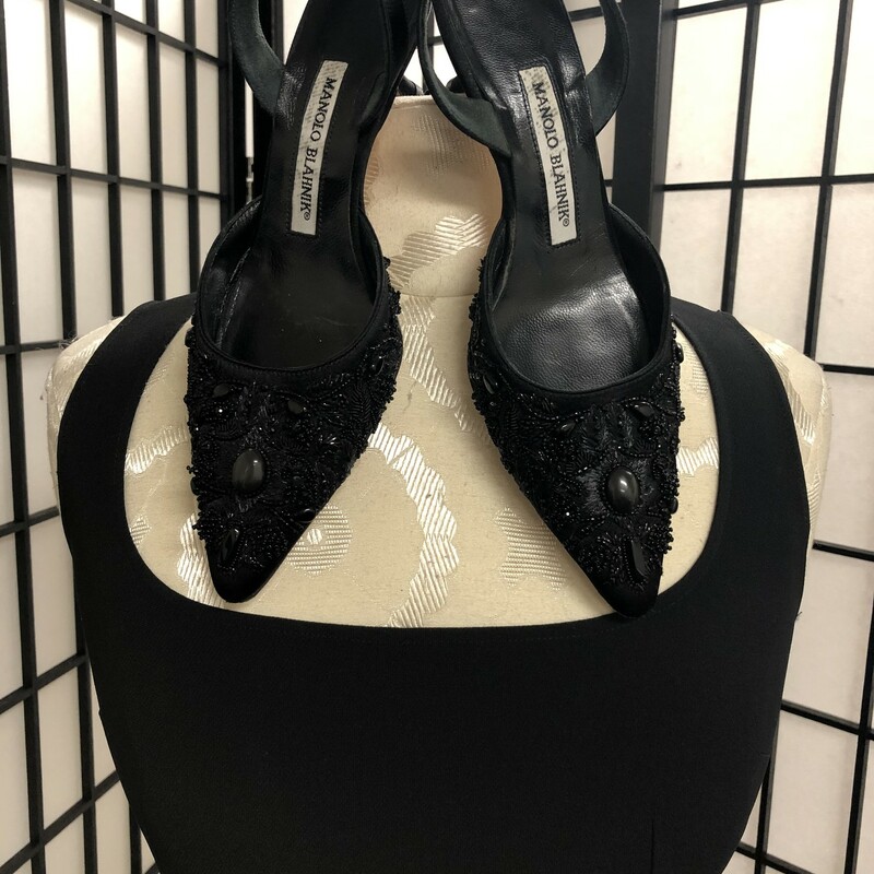 MANOLO BLAHNIK SLING BACK HEELS - SIZE 35 1/2 (ITALIAN), 5 1/2 (US).  STUNNING  pair of pointed toed slingback pumps, numerous beaded  embelishments with a princess sculptured heel,  a height of 2 3/8\". Slingback strap has a small piece of elastic for a more comfortable fit.  This style by Manolo Blahnik typically runs narrow and a 1/2 size small.  Condition = Very good - minor discoloration on insoles and base.  These would be a perfect accessory to your \"little black dress\"!!