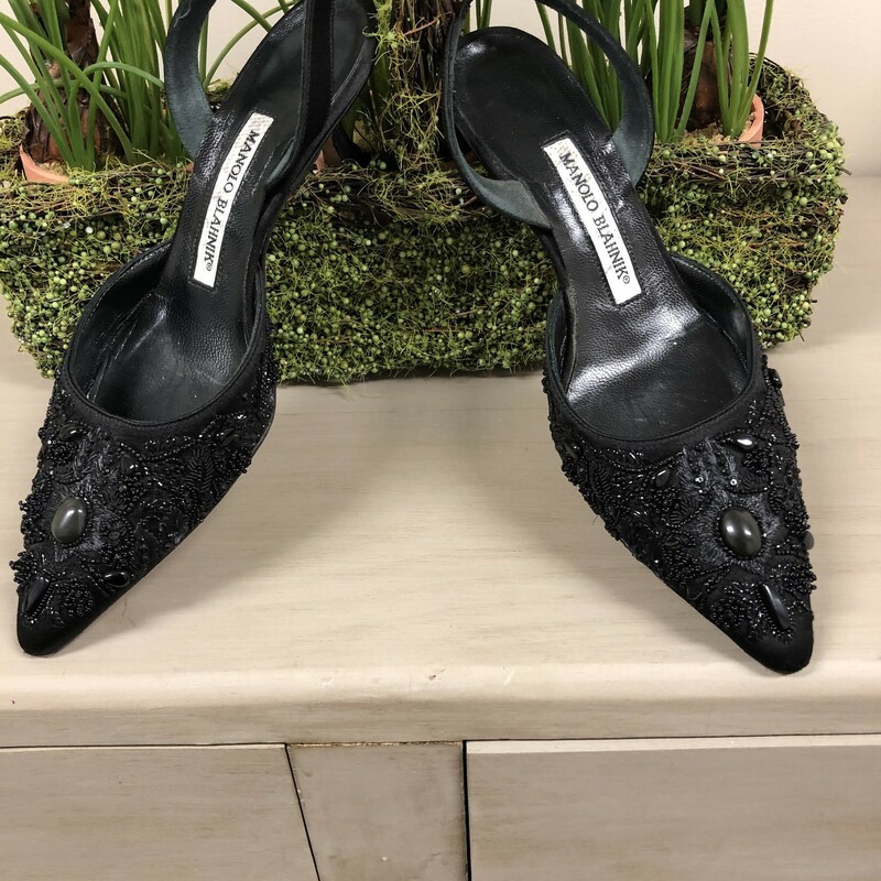 MANOLO BLAHNIK SLING BACK HEELS - SIZE 35 1/2 (ITALIAN), 5 1/2 (US).  STUNNING  pair of pointed toed slingback pumps, numerous beaded  embelishments with a princess sculptured heel,  a height of 2 3/8\". Slingback strap has a small piece of elastic for a more comfortable fit.  This style by Manolo Blahnik typically runs narrow and a 1/2 size small.  Condition = Very good - minor discoloration on insoles and base.  These would be a perfect accessory to your \"little black dress\"!!