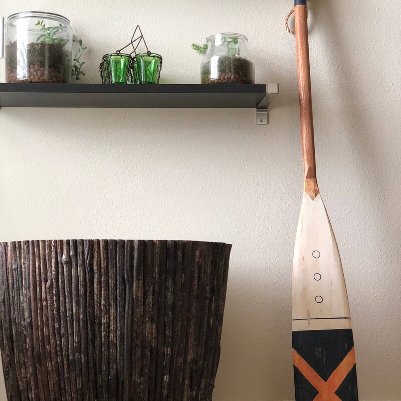 Navy With Orange Cross Oar  60in<br />
<br />
nspired by a mix of bold popular nautical colors and design, this vintage style oar is an artistic interpretation of the images from the shoreline. The solid wood, eco-friendly piece is handmade through the honed talents of highly skilled artisans.