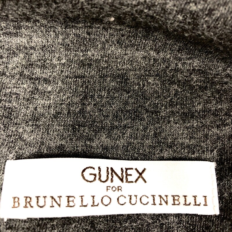 BRUNO CUCCINELLI/ GUNEX  CHARCOAL GREY  SKIRT - SIZE  I 40 (USA 4).  As always a Bruno Cuccinelli work of art, made in Italy synonymous with quality and design creativity.   You will see his unique styling at work in this knee length pull on skirt due to the fact of a 10.5\" pleated base protion with a  drawstring style hem!!   (Please note pictures).  Skirt also has two side gathered sections on upper portion of skirt.which would allow for a more comfortable fit.  Composition  = 100% virgin wool.  Approximate measurements = length = 23\", waist = 30\".  I have taken the liberty of pairing this with a Gucci cardigan.  Not much more we can say about this unusual gem.