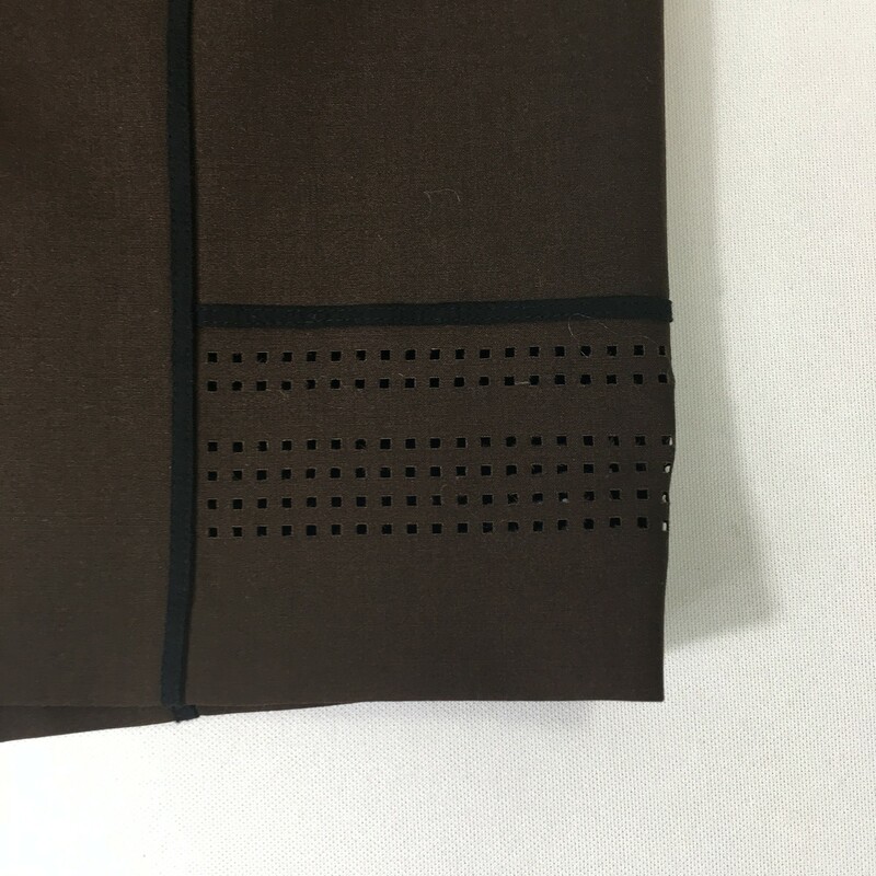 100-1094 Worth, Brown, Size: 4 brown skirt with black lines and square holes on the bottom 95% wool 5% elastane  good